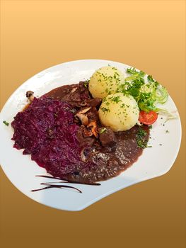 Gourmet game fillet with potato dumplings, goulash garnished