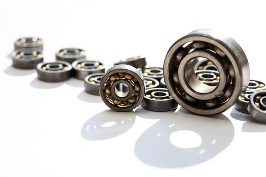 Industrial concept. Lot of ball bearings on white background