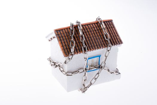 house in chains on a white background