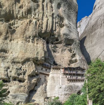 Monastic cave hermit monks houses and rock formation in Meteora near Trikala, Greece.