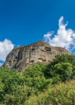 Monastic cave hermit monks houses and rock formation in Meteora near Trikala, Greece.