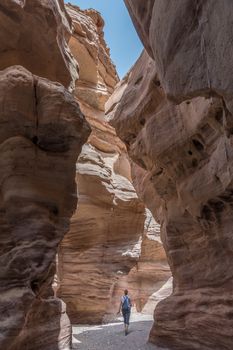 woman walking in the red canyon in israel