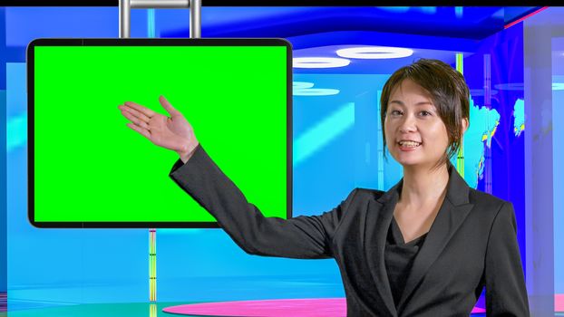 Female Asian American News anchorwoman in virtual TV studio showing green screen suspended display, original design elements