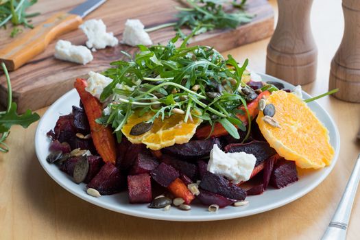 Vegetable salad - baked red beets and carrots, fresh oranges and arugula, goat cheese, roasted pumpkin and sunflower seeds.
