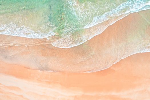 Aerial shot of waves and sand patterns on a beach in Sydney Australia