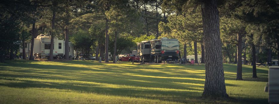 Panorama view RV campground with plenty of trees for both tent camping and RV sites in Texas, America