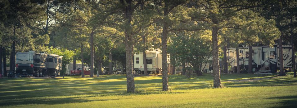 Panorama view RV campground with plenty of trees for both tent camping and RV sites in Texas, America