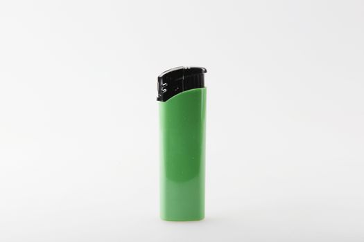 Green Lighter Against White Background