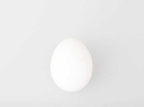 Close-Up Of Egg Over White Background