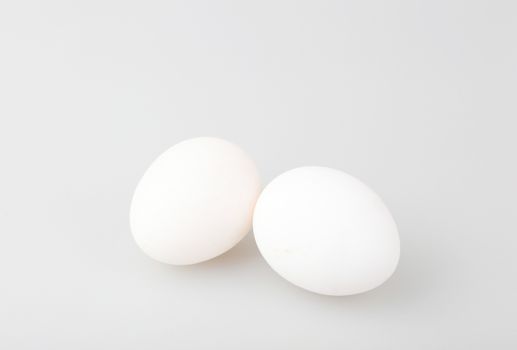 Close-Up Of Egg Over White Background