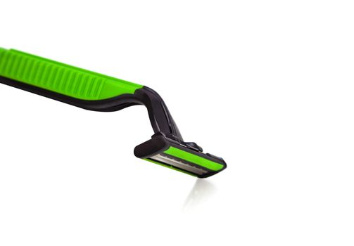 Green men razor. Studio shot isolated on white background