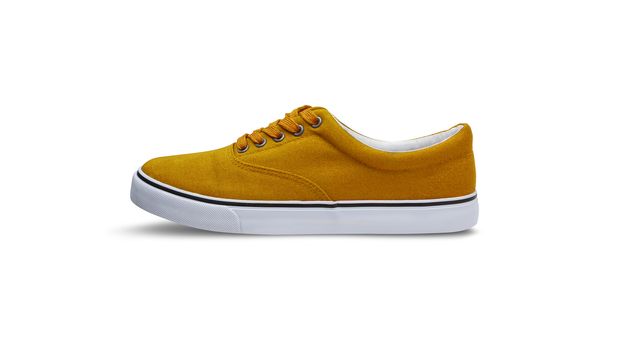 Yellow canvas shoes isolated on white background with clipping path