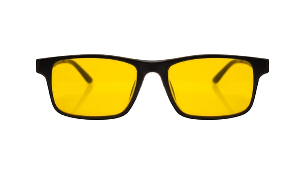 Single sunglasses with black plastic frame and yellow glass on a white background. With clipping path