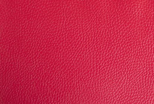 Bright red leather background, part of an old binder folder