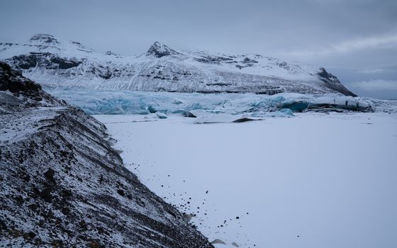 Panoramic image of the snow-coverd glacier Svinafellsjoekull on a winter day after snowfall, Iceland, Europe