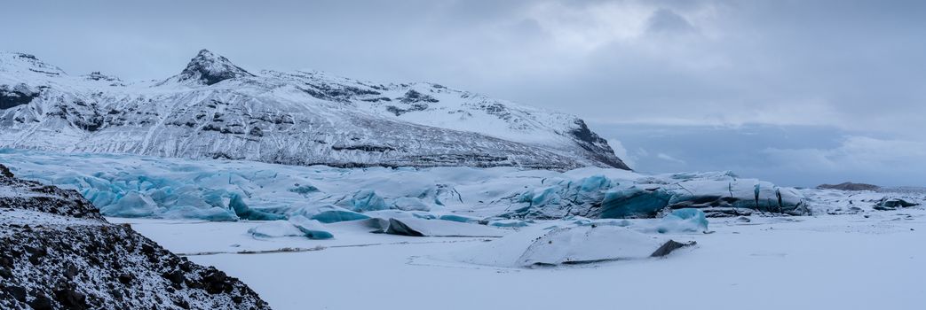 Panoramic image of the snow-coverd glacier Svinafellsjoekull on a winter day after snowfall, Iceland, Europe