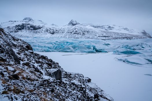 Panoramic image of the snow-coverd glacier Svinafellsjoekull on a winter day after snowfall, Iceland, Europe