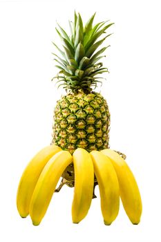 Pineapple fruit in spinning yellow, ripe bananas isolated against white background