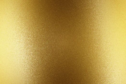 Light shining on gold steel wall, abstract texture background