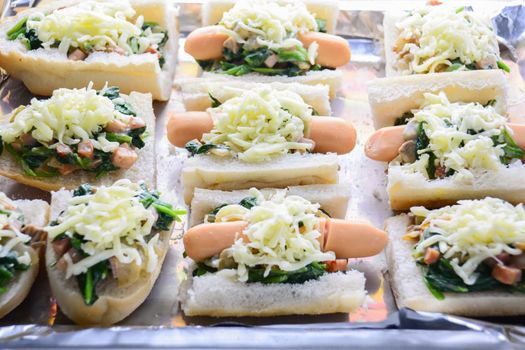 Baked Spinach with Cheese, sausage on Baguette, French bread
