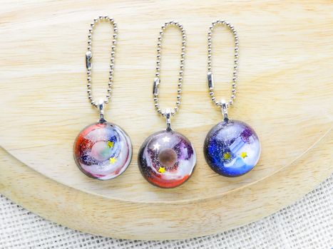 Create galaxy drink coasters using resin, glitter and pigment powders, handmade items. Suitable for keychains, necklace and pendant.
