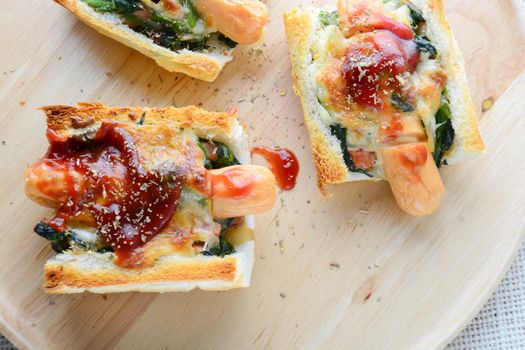 Baked Spinach with Cheese, sausage on Baguette, French bread
