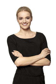 Portrait of smiling young attractive woman in black dress. Isolated at white background.