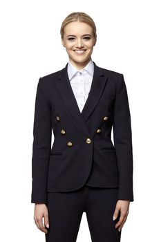 Portrait of cheerful young blonde woman in a dark business suit. Studio shot isolated on white background.