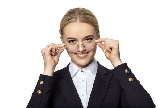 Cute young woman covenant a eyeglass frames. Studio shot. Isolated at white background. 