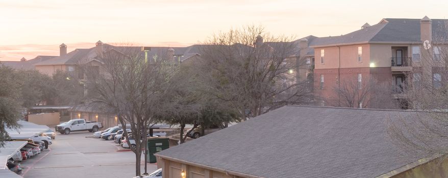 Panorama view typical aerial of apartment complex with detached garage and covered parking lots in Texas, America