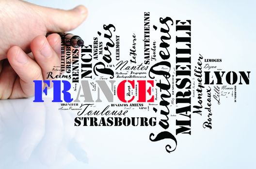 Localities in France word cloud travel concept over human hand background
