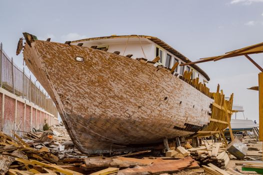 Wooden ship being renovated in a construction site of the city of Hurghada in Egypt
