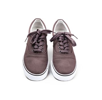 A pair of brown canvas shoes isolated on white background with clipping path