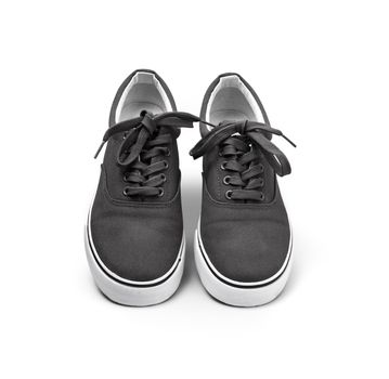 A pair of black canvas shoes isolated on white background with clipping path