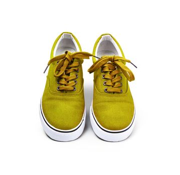 A pair of Yellow canvas shoes isolated on white background with clipping path