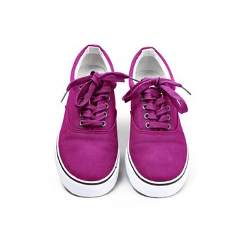 A pair of pink color canvas shoes isolated on white background with clipping path