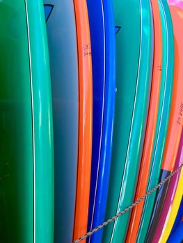 Colourful surfboards lined up ready for sale