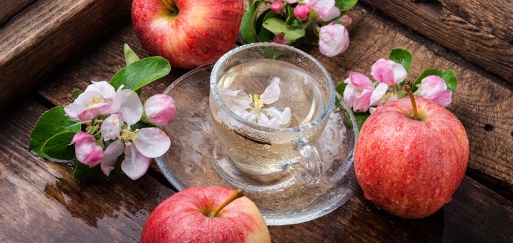 Cup of fruit tea with apple flavor.Hot apple tea with fresh apples