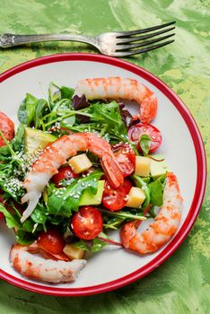 Healthy salad of shrimp, mixed greens and tomatoes.Healthy food