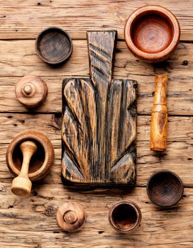 Empty wooden mortar and pestle on wooden old background.Cooking utensils