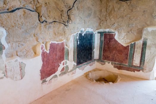 leftovers of old wall paintings at the ruins of the ancient Masada fortress in Israel,build by Herod the great