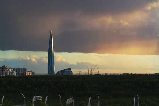 huge thundercloud on the outskirts of the city before the rain - image.