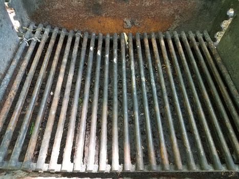 dirty metal barbecue grill with rust and grease and grime