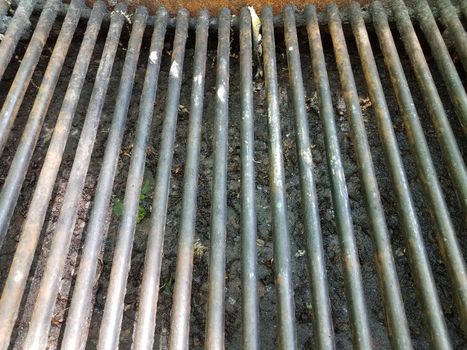 dirty metal barbecue grill with rust and grease and grime