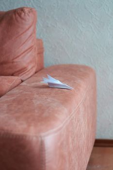 Paper plane model. Origami. Handmade paper plane. Travel concept. White paper plane model.