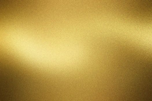 Shiny brushed golden metal wall, abstract texture background