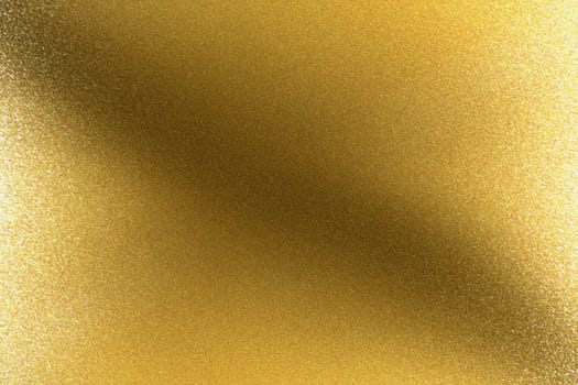 Glowing brushed golden metal wall, abstract texture background