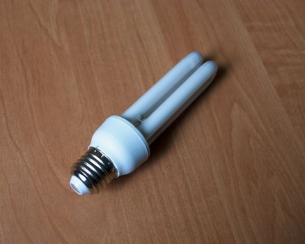 LED lamp lying on the table, economy lamp