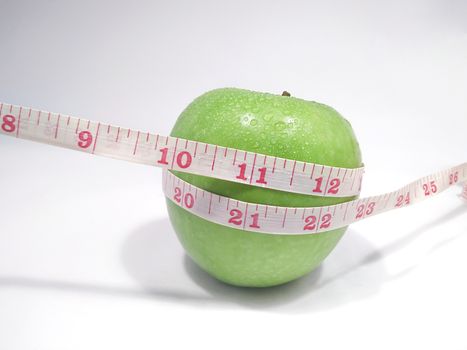 Green Apple Tied up with a Measuring Tape