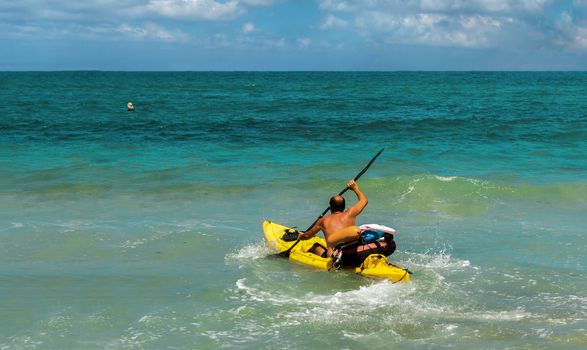 In the days of the swimming season at sea are lifeguard training on kayaks